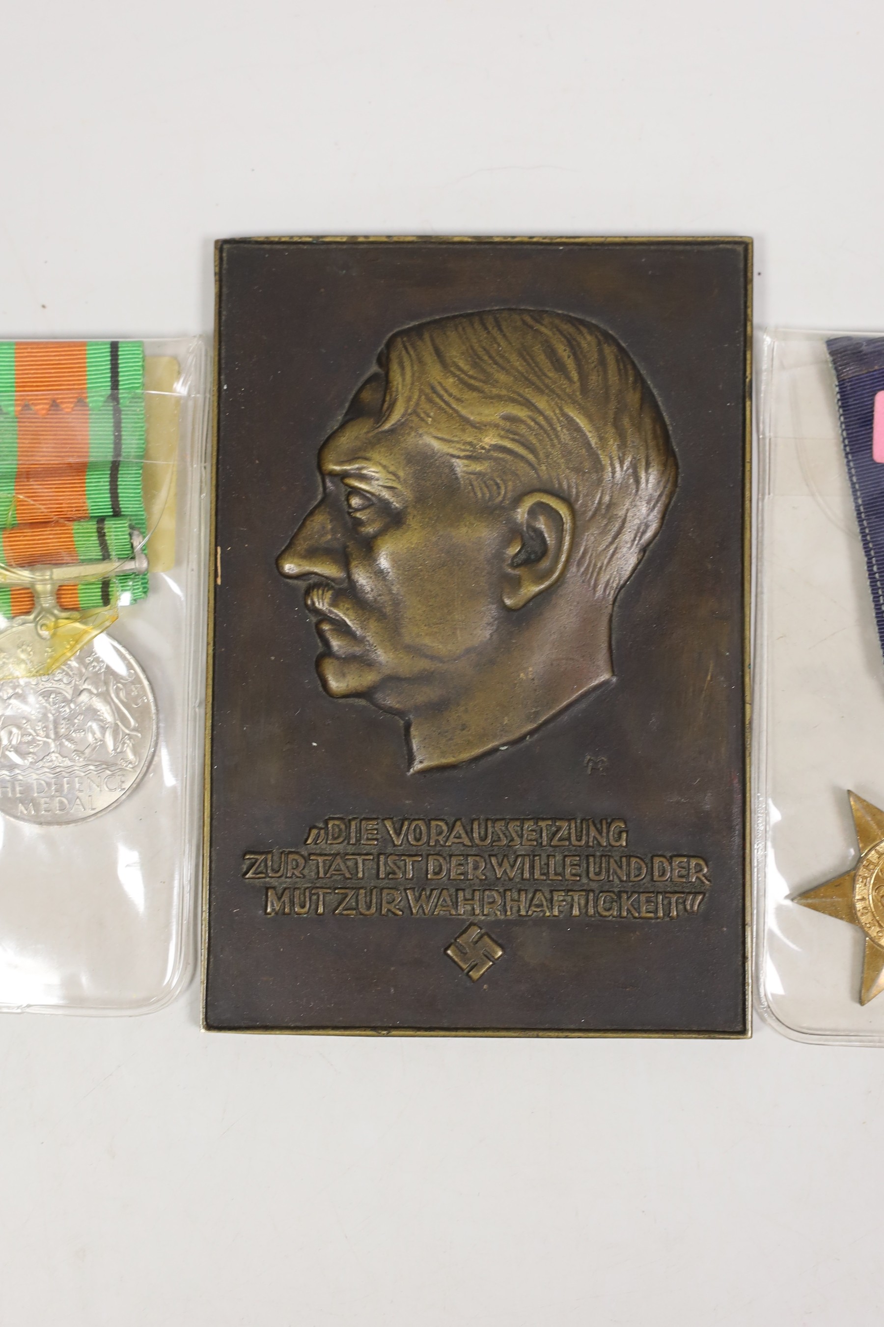 Two WWI medals, other medals and an Adolf Hitler bronze plaque